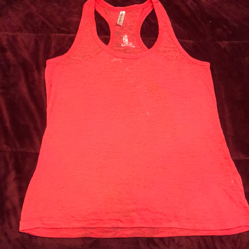 Coral/pink tank with birds on back.